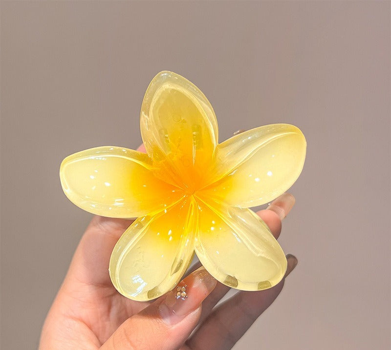 pince a cheveux fleurs jaune brillante